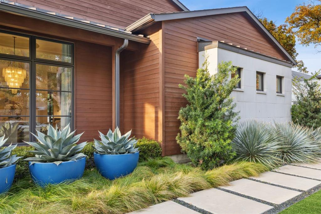 4447 Taos Road Dallas, TX 75209 - Photo 3 of 38 a potted plant sitting in front of a house