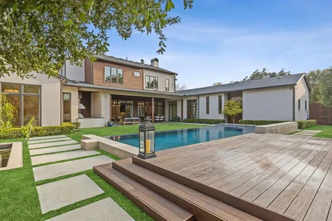 a view of swimming pool with lounge chair