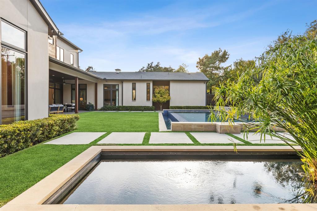 4447 Taos Road Dallas, TX 75209 - Photo 35 of 38 a view of backyard with large trees and plants