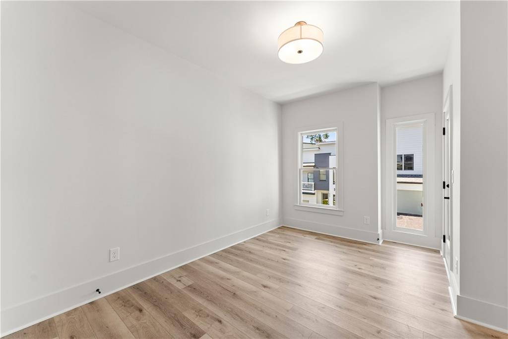 372 Forrest Avenue Gainesville, GA 30501 - Photo 26 of 29 wooden floor in an empty room with a window
