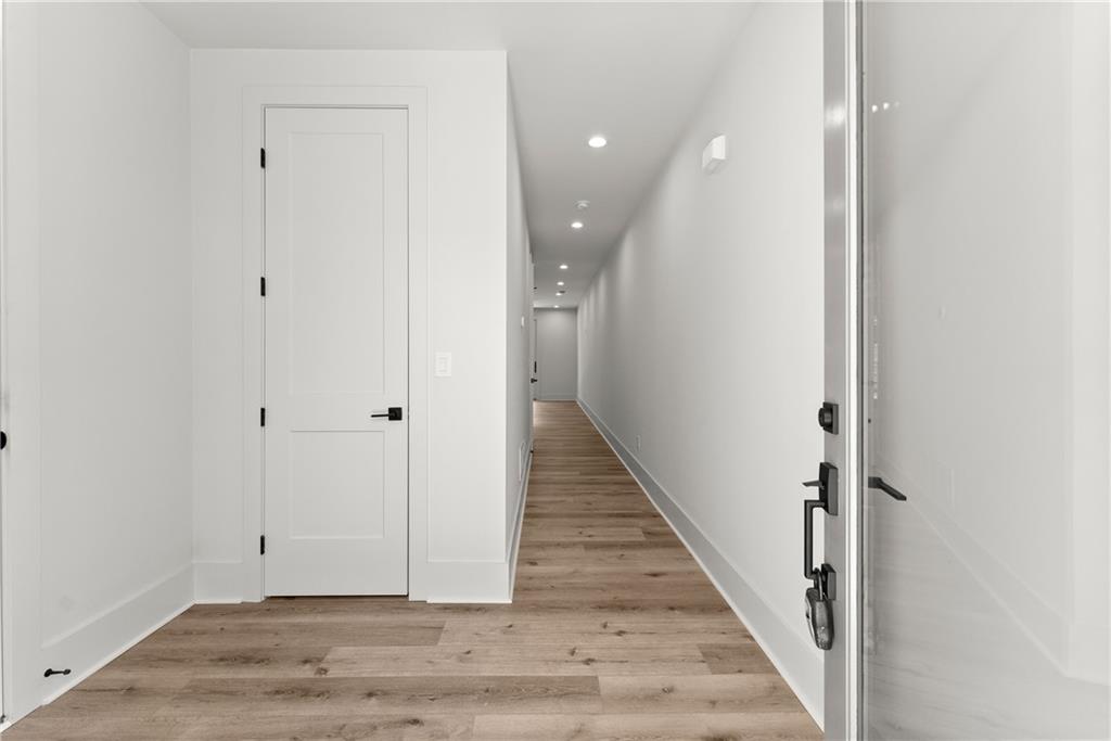372 Forrest Avenue Gainesville, GA 30501 - Photo 4 of 29 a view of a hallway with wooden floor and staircase