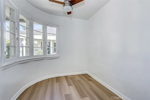 a bathroom with a sink a window and shower