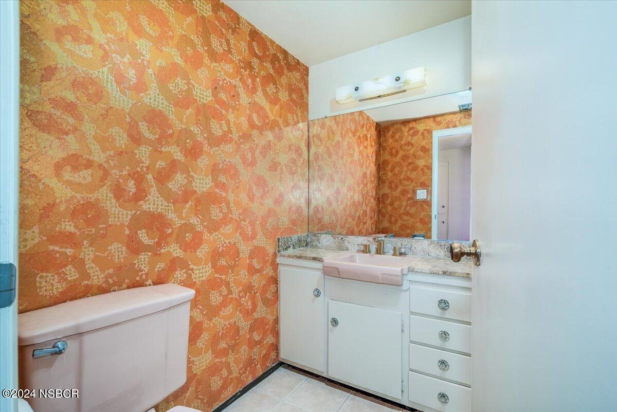 715 South Bradley Road, Unit 25 Santa Maria, CA 93454 - Photo 18 of 28 a bathroom with a sink toilet vanity and window