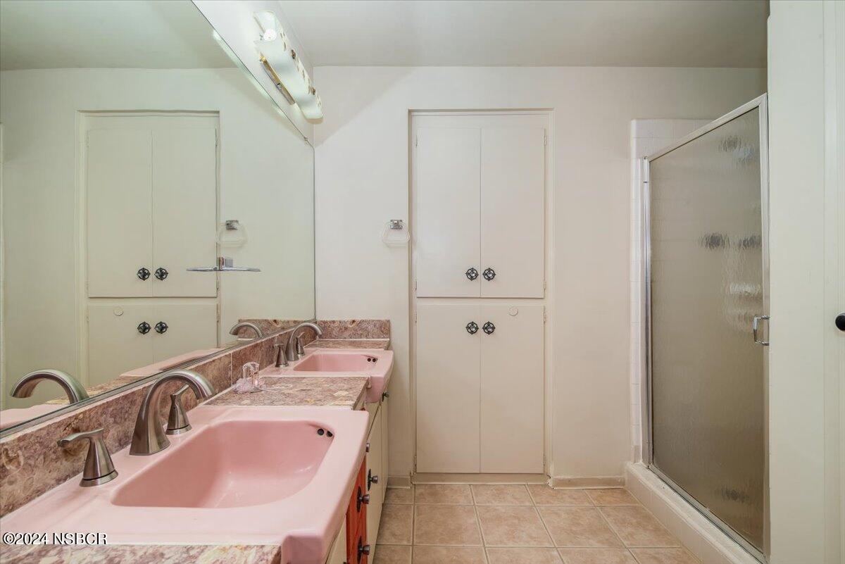 715 South Bradley Road, Unit 25 Santa Maria, CA 93454 - Photo 20 of 28 a bathroom with a sink and a mirror
