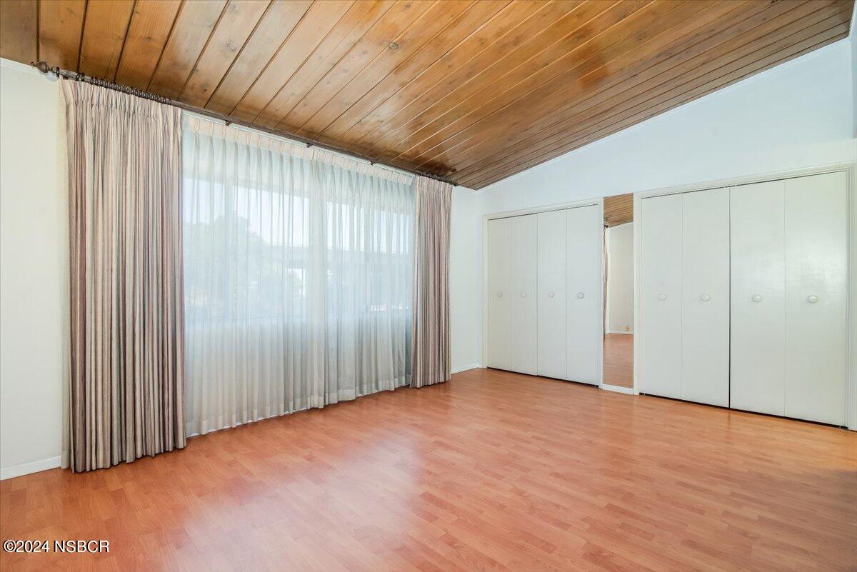 715 South Bradley Road, Unit 25 Santa Maria, CA 93454 - Photo 22 of 28 a view of an empty room with wooden floor