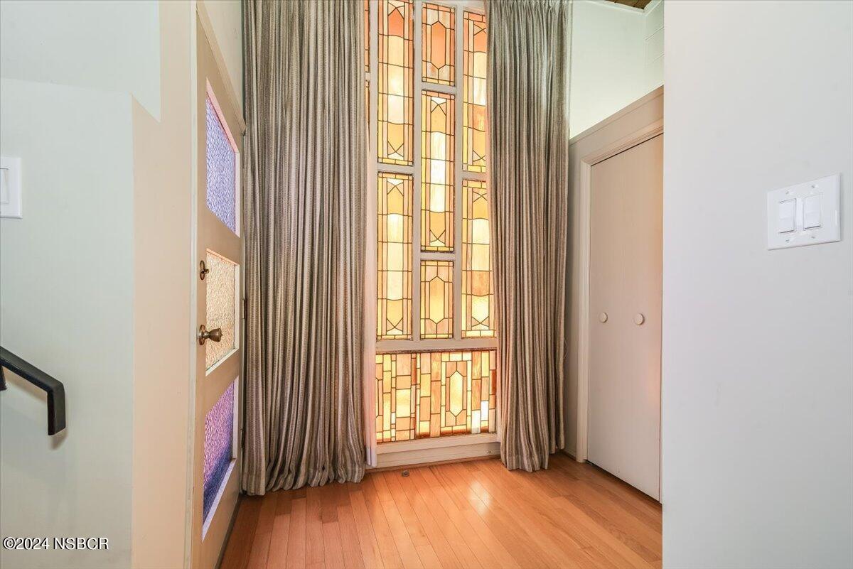 715 South Bradley Road, Unit 25 Santa Maria, CA 93454 - Photo 5 of 28 a view of an empty room with wooden floor and a window