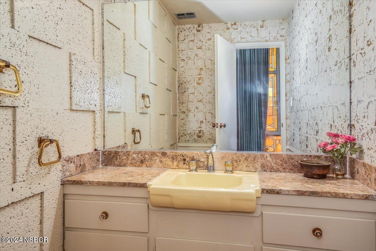 715 South Bradley Road, Unit 25 Santa Maria, CA 93454 - Photo 6 of 28 a bathroom with a granite countertop sink and a mirror