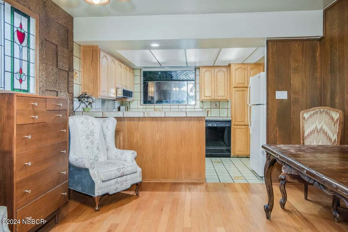 715 South Bradley Road, Unit 25 Santa Maria, CA 93454 - Photo 9 of 28 a kitchen with stainless steel appliances granite countertop a stove and a refrigerator