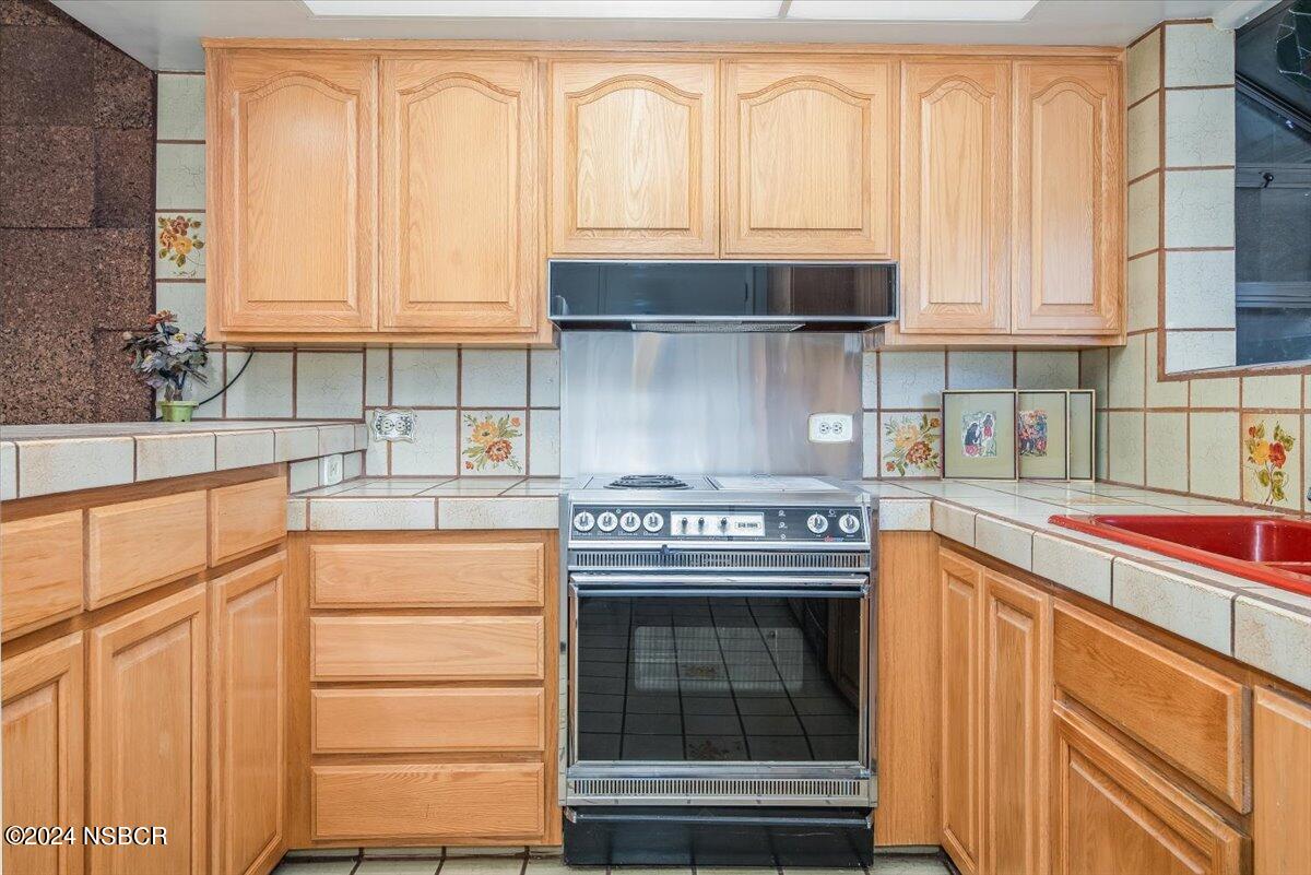 715 South Bradley Road, Unit 25 Santa Maria, CA 93454 - Photo 10 of 28 a kitchen with granite countertop cabinets and appliances