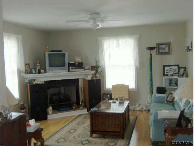 64 Ashburn Road Cumberland, VA 23040 - Photo 5 of 8 a living room with furniture and a fireplace