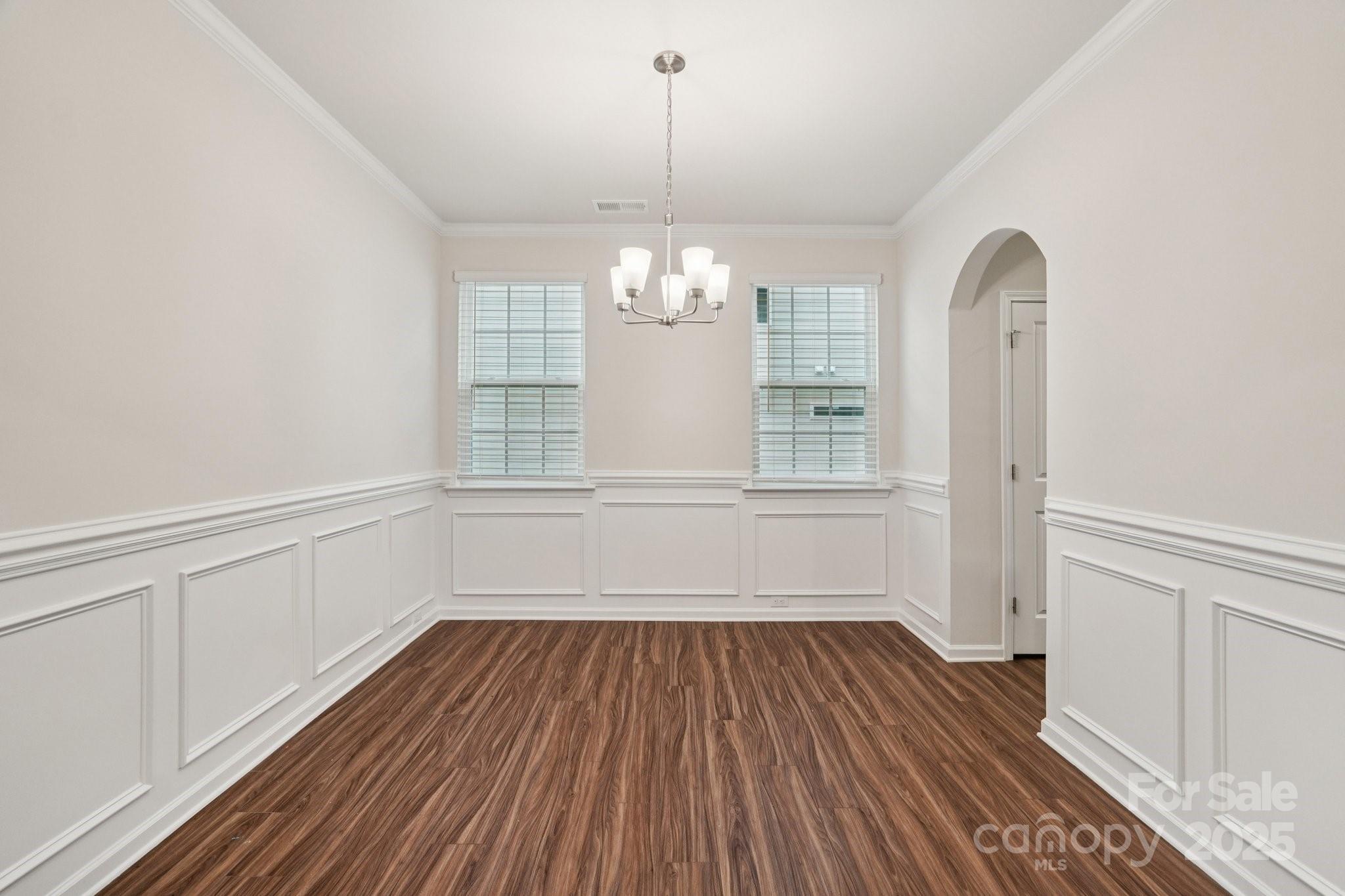 299 Hamptons Cove Road Troutman, NC 28166 - Photo 15 of 40 a view of a room with wooden floor window and entryway