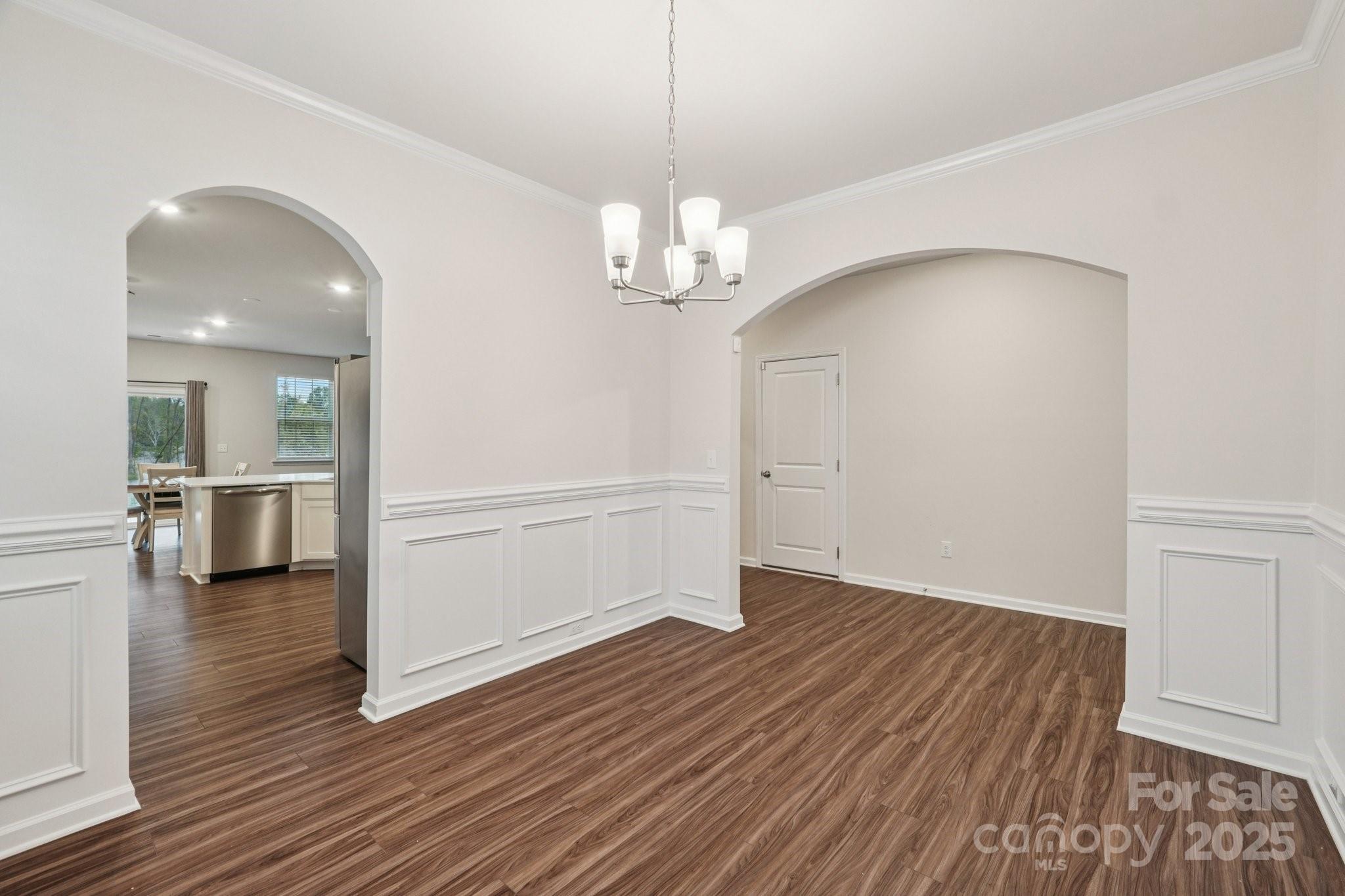 299 Hamptons Cove Road Troutman, NC 28166 - Photo 16 of 40 a view of a livingroom with wooden floor