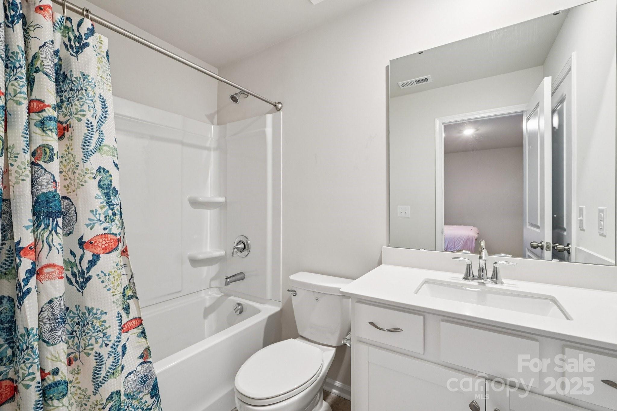 299 Hamptons Cove Road Troutman, NC 28166 - Photo 22 of 40 a bathroom with a sink a toilet and a bathtub