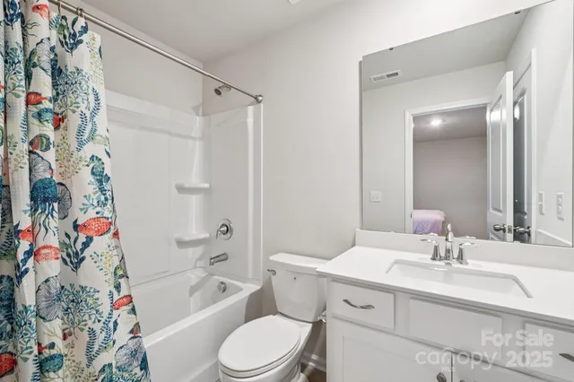 a spacious bedroom with a bed and window