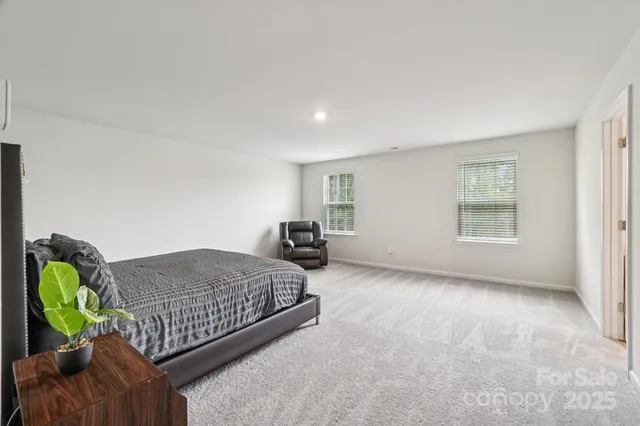 a bedroom with a bed and gym equipment