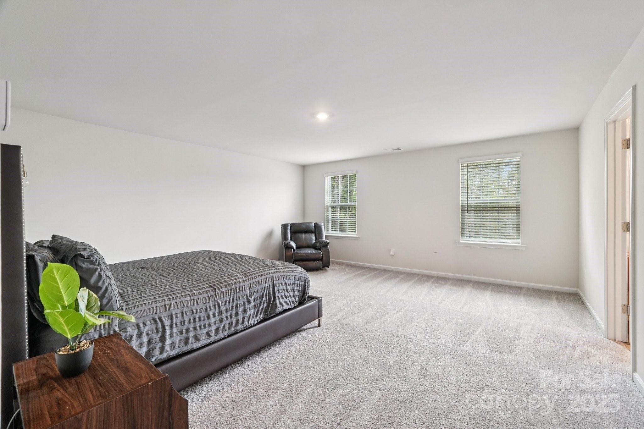 299 Hamptons Cove Road Troutman, NC 28166 - Photo 27 of 40 a living room with furniture and a window