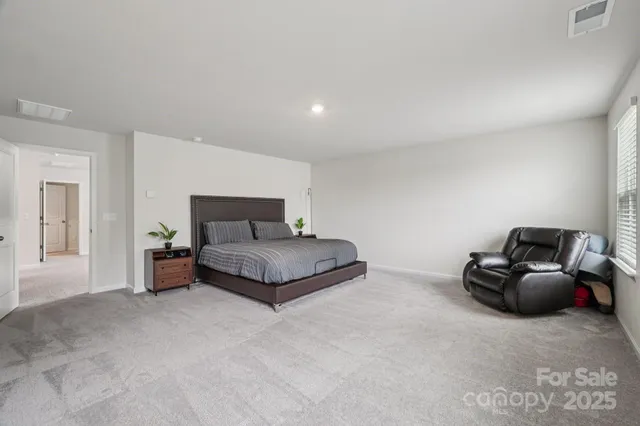a spacious bathroom with a granite countertop sink mirror and double