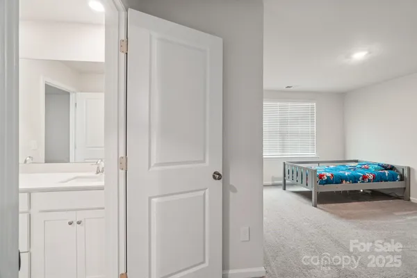 a spacious bathroom with a granite countertop sink mirror and double