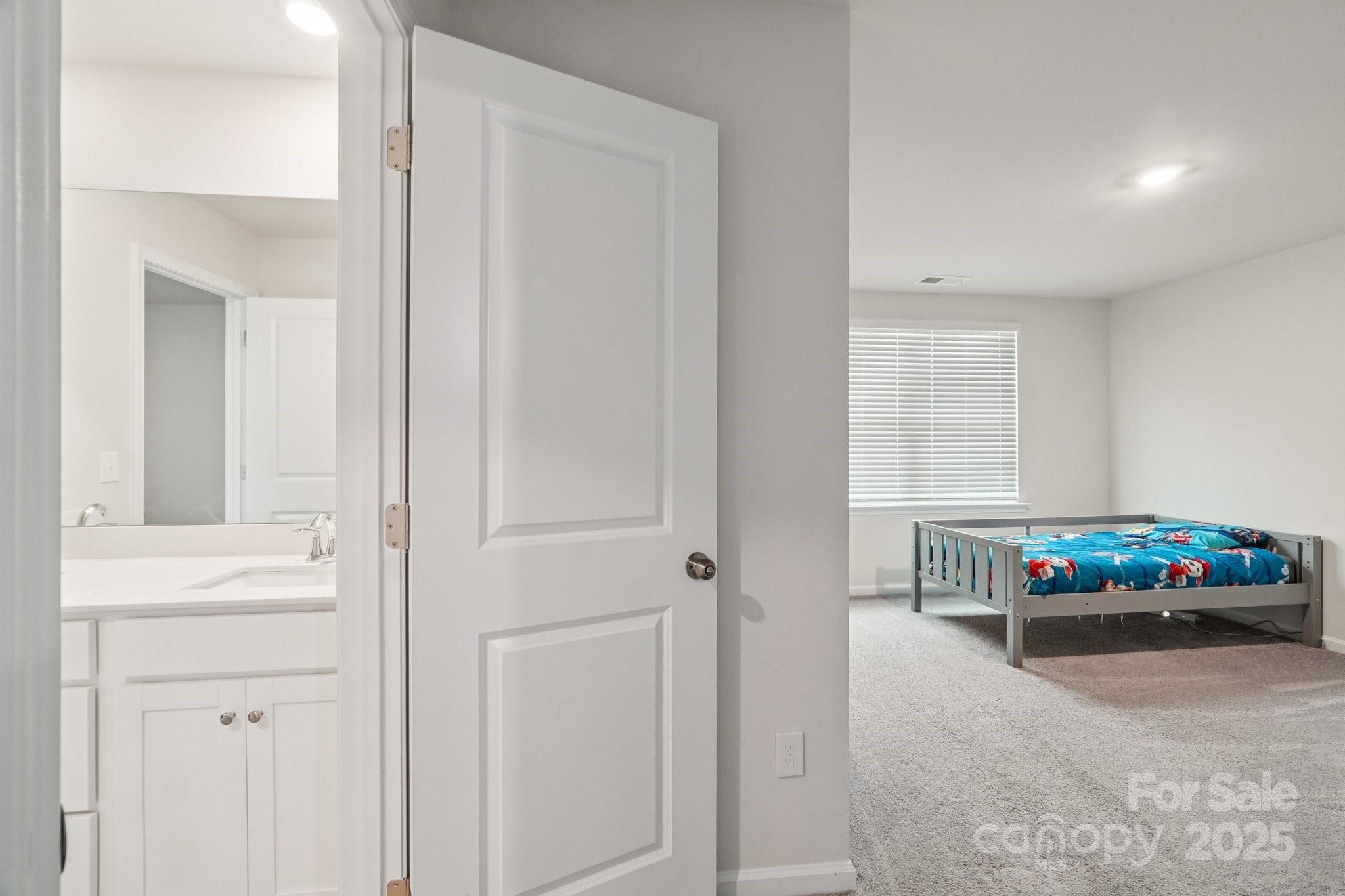 299 Hamptons Cove Road Troutman, NC 28166 - Photo 29 of 40 a living room with a dresser and a window