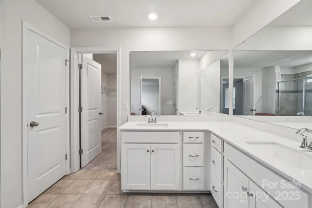 a spacious bathroom with a tub and a sink