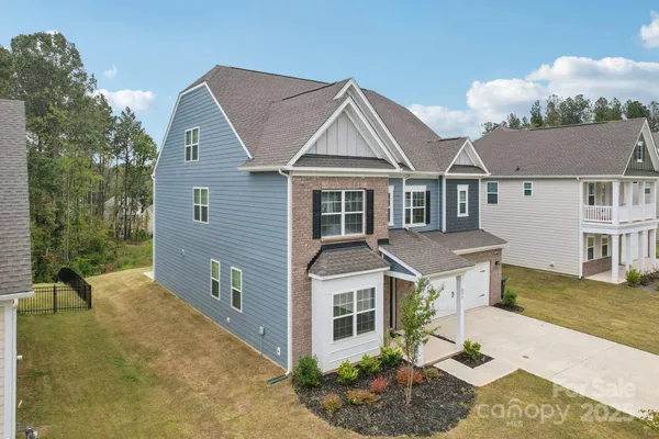 front view of a house with a yard