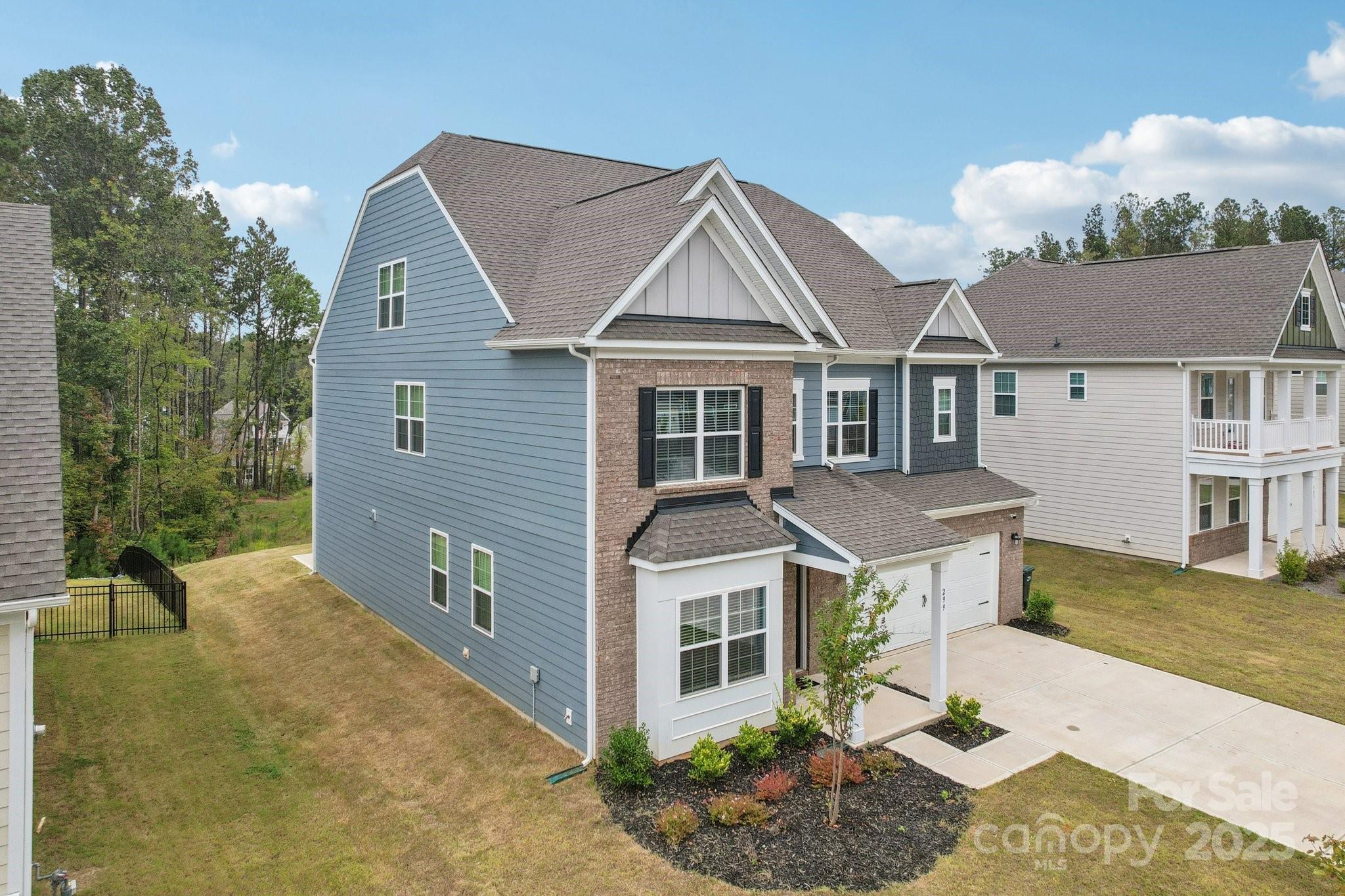 299 Hamptons Cove Road Troutman, NC 28166 - Photo 3 of 40 front view of a house with a yard