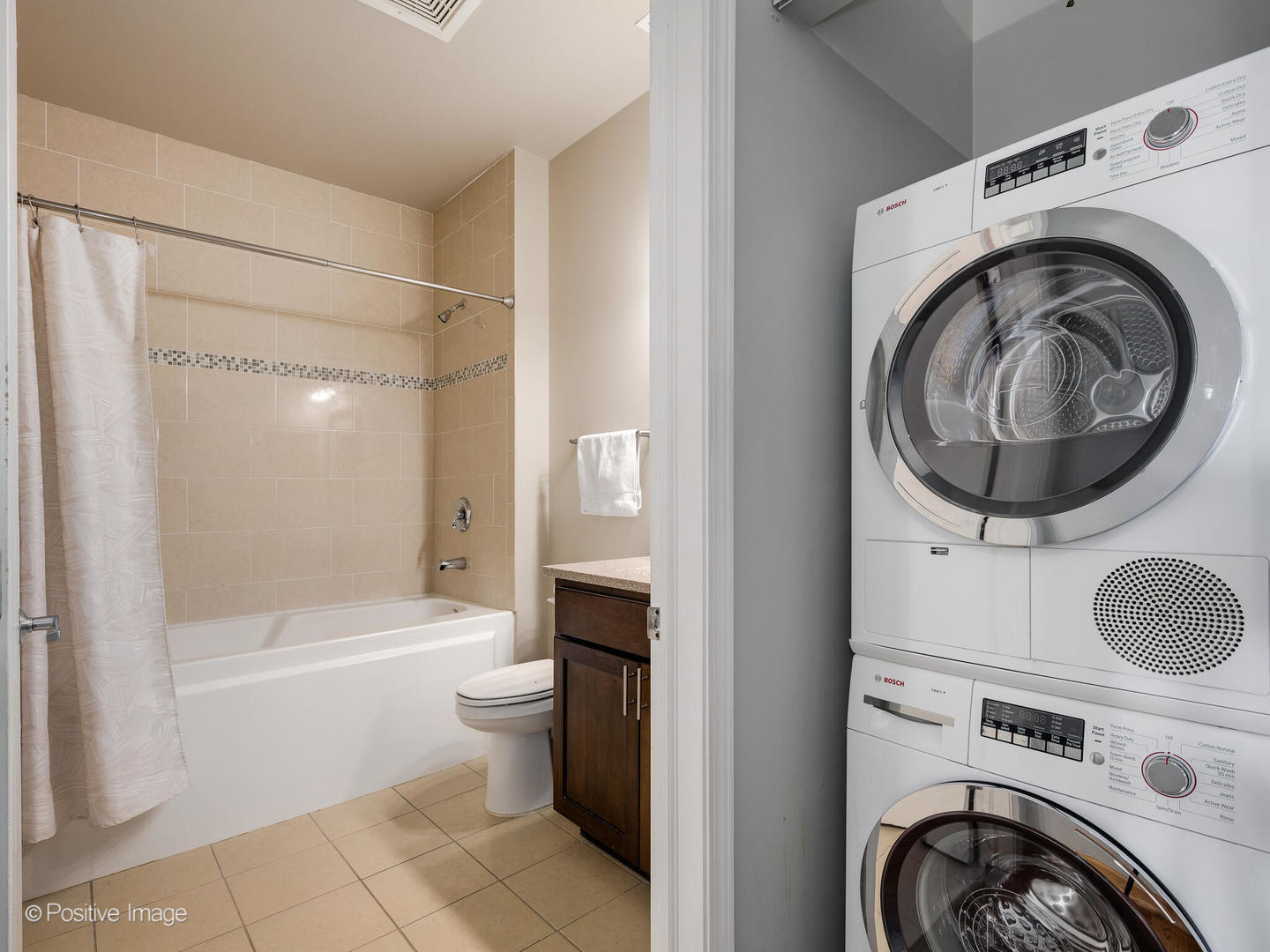 1301 West Madison Street, Unit 402 Chicago, IL 60607 - Photo 16 of 22 a bathroom with a sink a toilet and shower