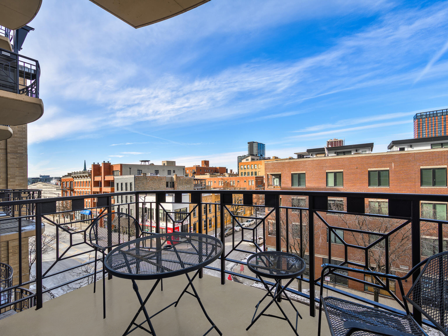 1301 West Madison Street, Unit 402 Chicago, IL 60607 - Photo 17 of 22 a view of a chairs and table on the terrace