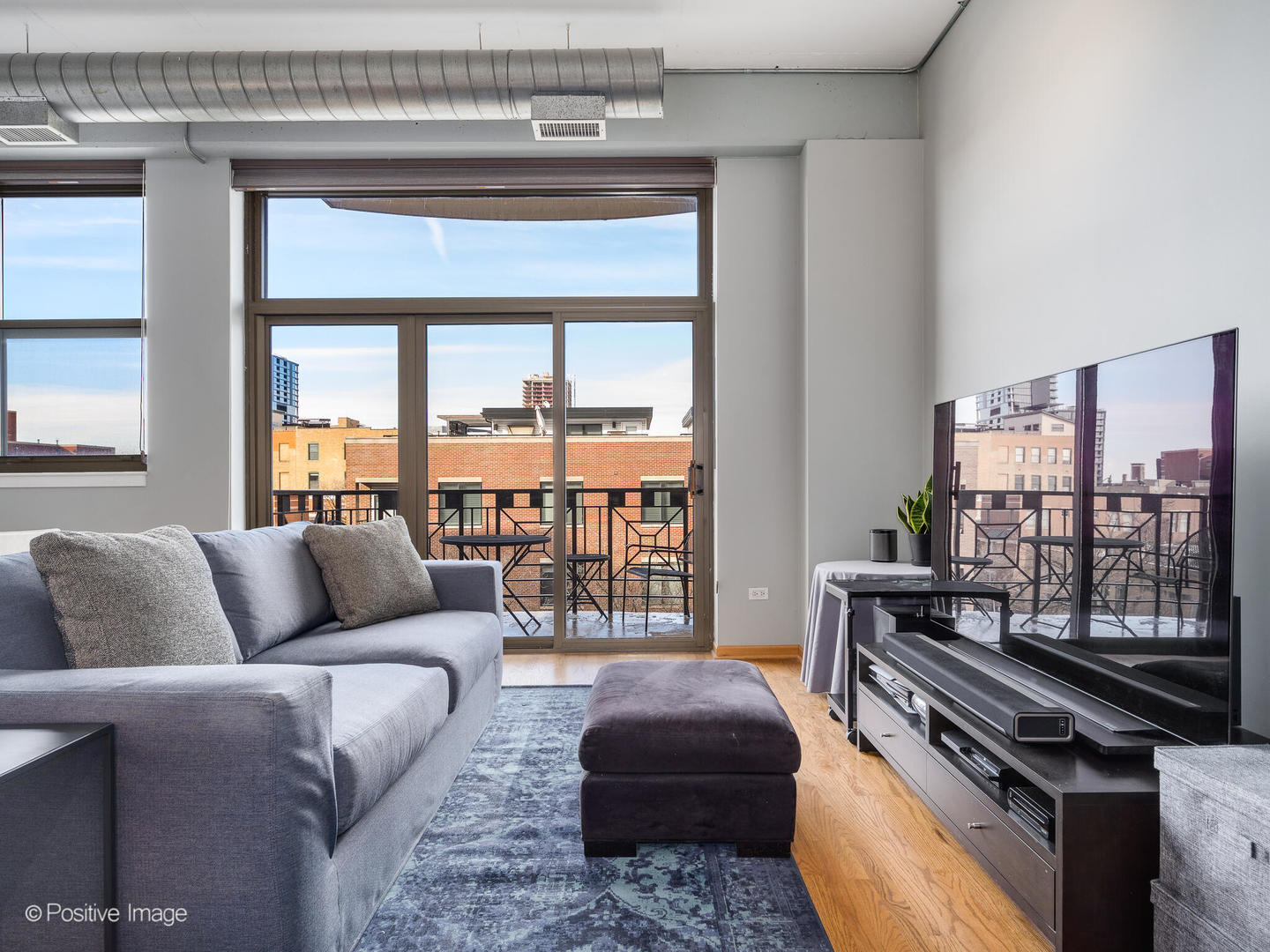 1301 West Madison Street, Unit 402 Chicago, IL 60607 - Photo 9 of 22 a living room with furniture and a floor to ceiling window
