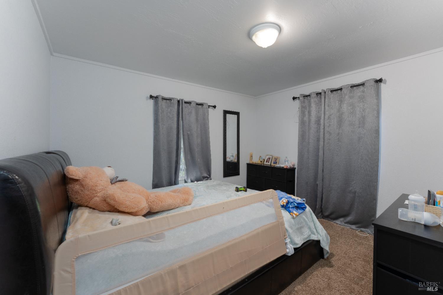 2580 Center Valley Road Willits, CA 95490 - Photo 20 of 43 a bedroom with a bed and a closet