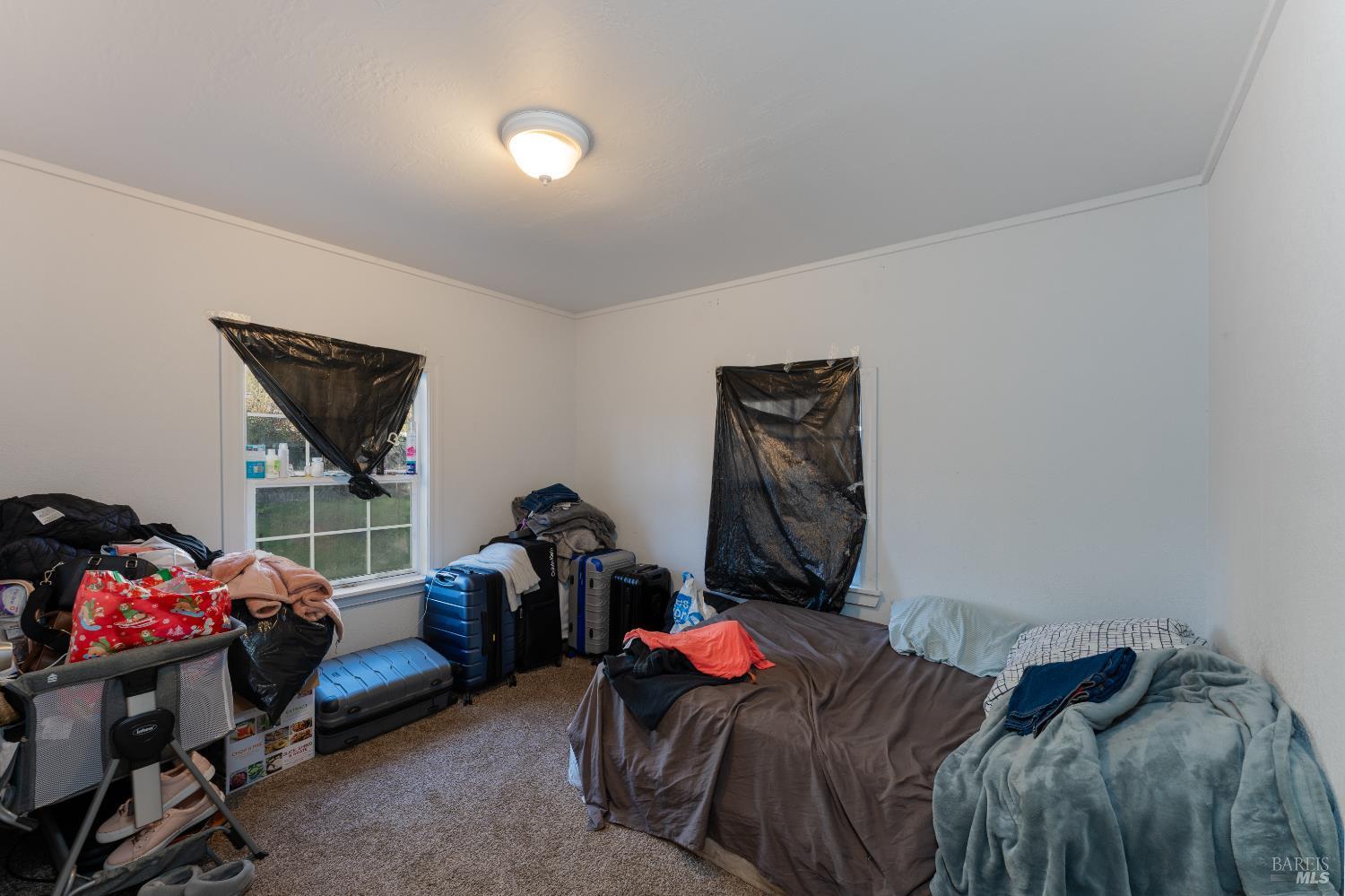 2580 Center Valley Road Willits, CA 95490 - Photo 21 of 43 a bedroom with a bed and a window