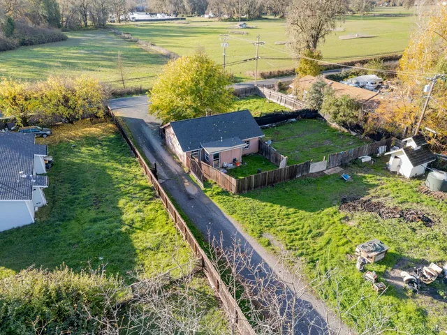 a view of a swimming pool with a yard
