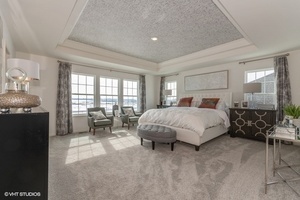 3622 Edelweiss Road Elgin, IL 60124 - Photo 6 of 11 a spacious bedroom with a bed a table and chairs