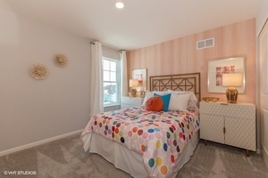 3622 Edelweiss Road Elgin, IL 60124 - Photo 9 of 11 a bedroom with a bed and a window