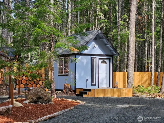 a house with trees in the background