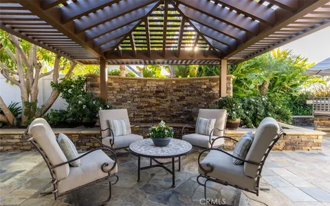 a view of a chairs and table in a patio