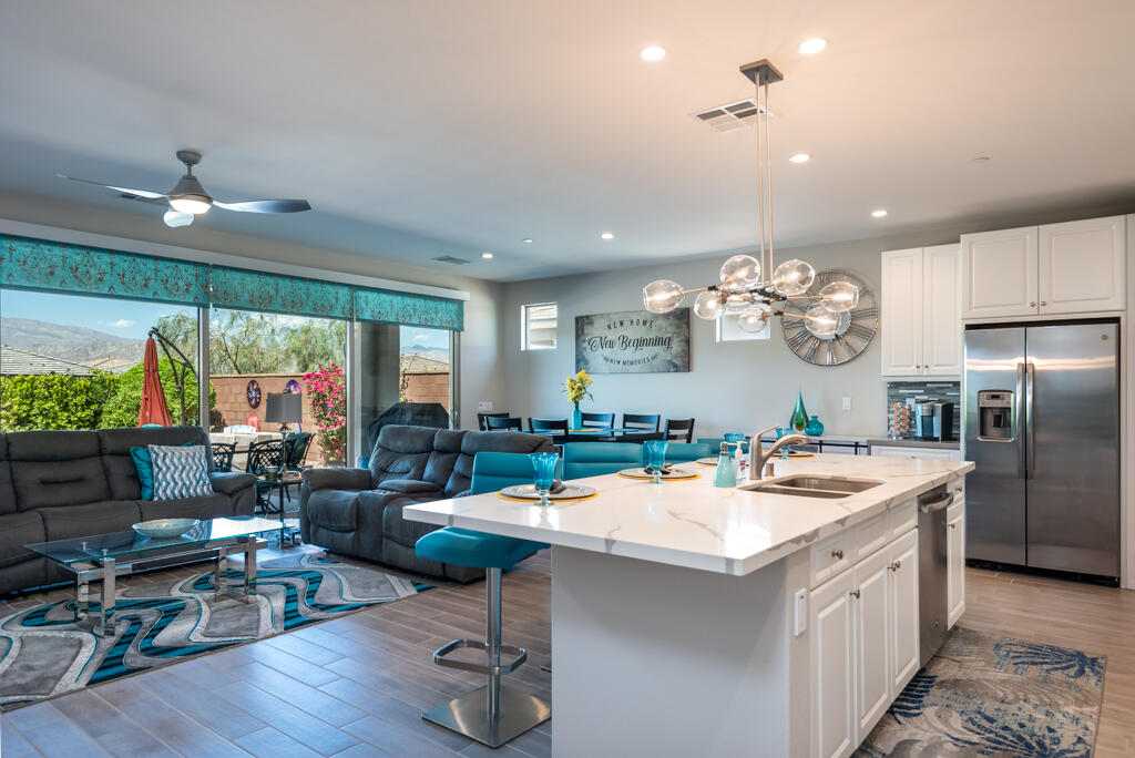 50715 Monterey Cyn Drive Indio, CA 92201 - Photo 12 of 43 a kitchen with a sink appliances and living room view