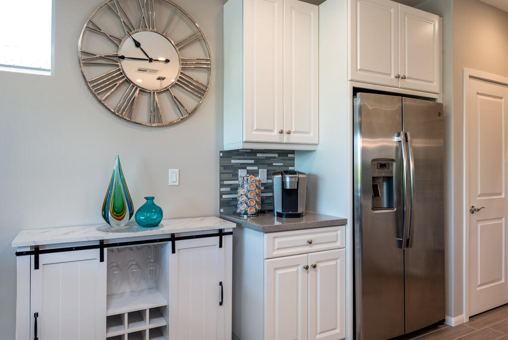50715 Monterey Cyn Drive Indio, CA 92201 - Photo 18 of 43 a kitchen with stainless steel appliances granite countertop a refrigerator a stove and a sink