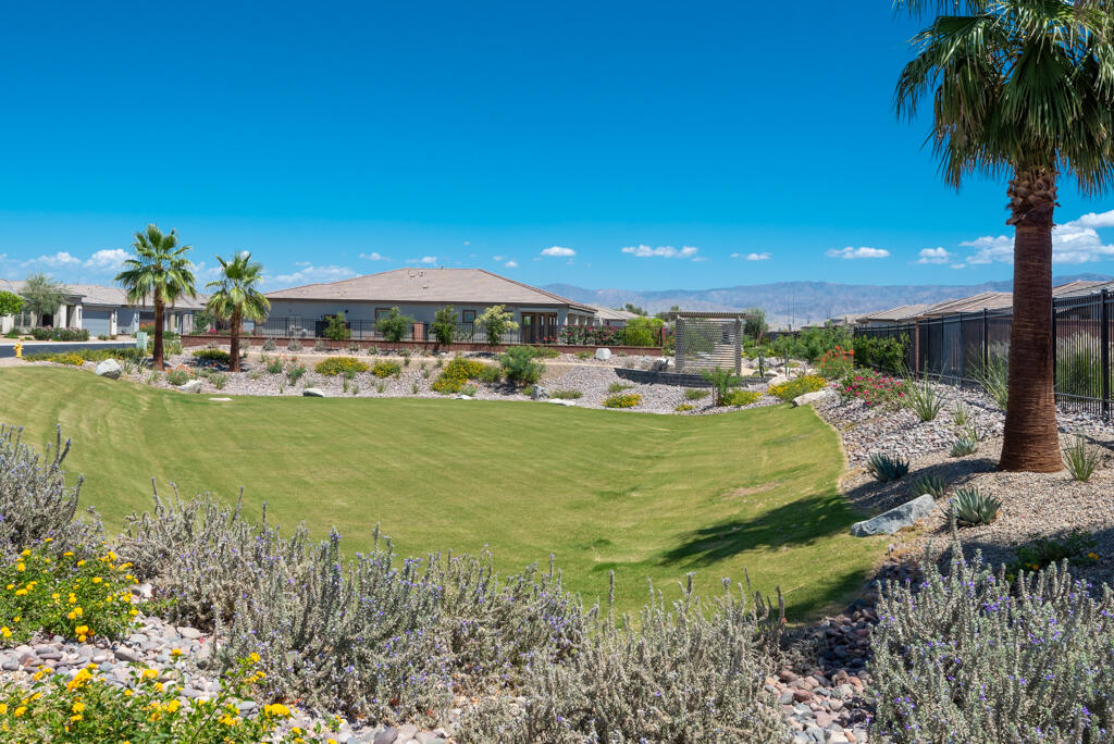 50715 Monterey Cyn Drive Indio, CA 92201 - Photo 34 of 43 a view of a house with a yard and lake view
