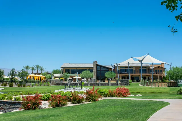 a swimming pool with outdoor seating and yard