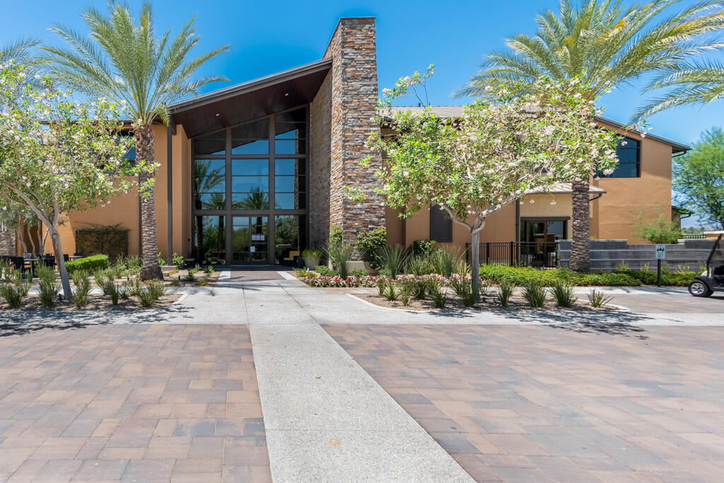 50715 Monterey Cyn Drive Indio, CA 92201 - Photo 39 of 43 a front view of a house with a yard and potted plants