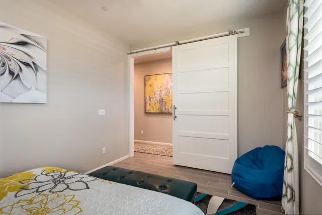 a bedroom with a bed and a cabinets