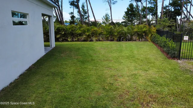 a view of a street with palm trees
