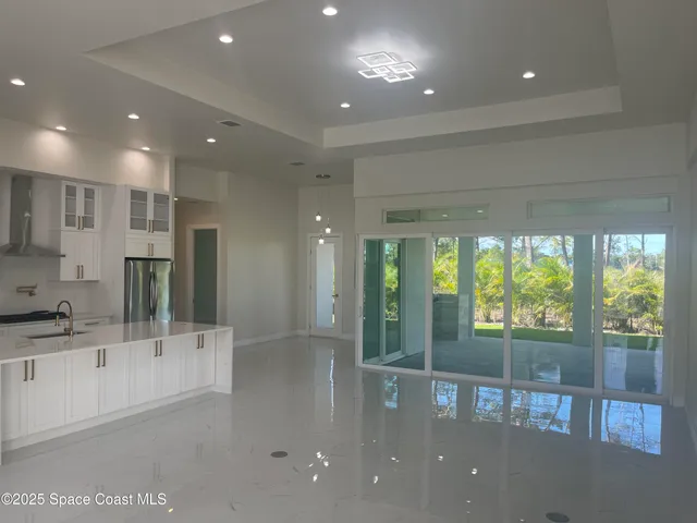 a view of a bathroom with a tub and shower