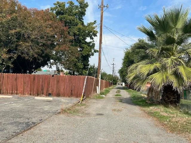 a view of street with parked cars