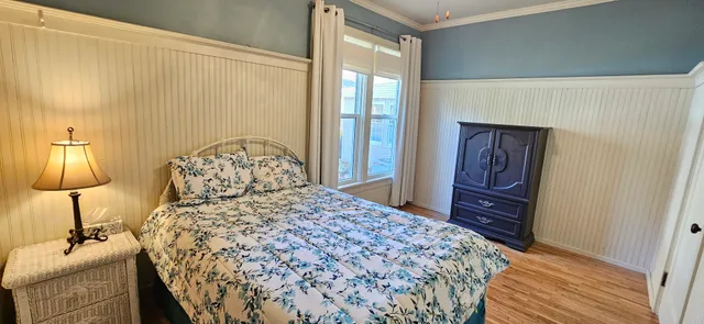 a bedroom with a bed and a lamp