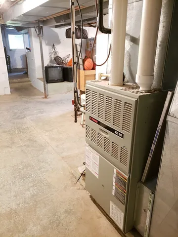 a view of living room with a baby crib