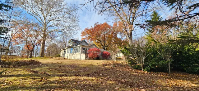 a house with trees in front of it