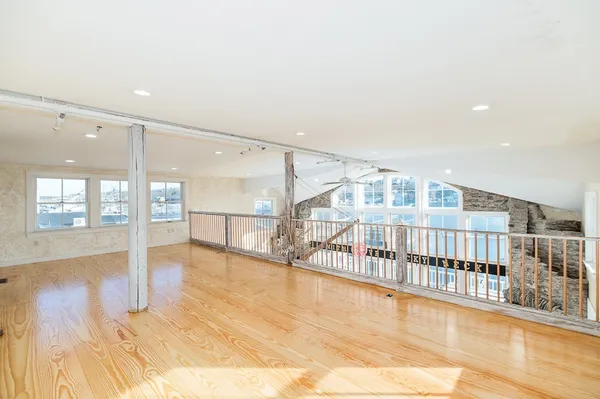 a view of an entryway with wooden floor