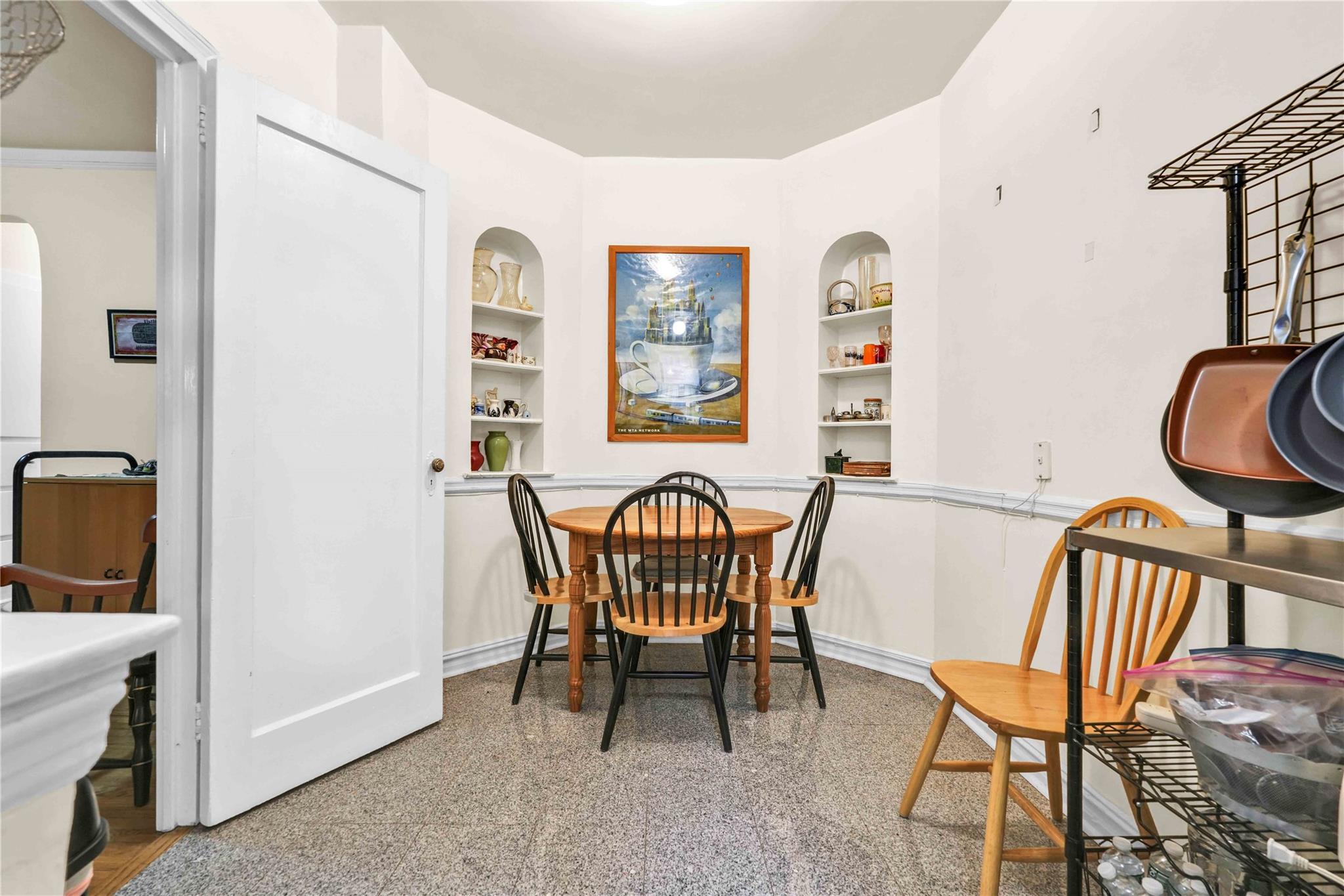 84-51 Beverly Road, Unit 5P Queens, NY 11415 - Photo 11 of 19 Dining room featuring built in features and baseboards